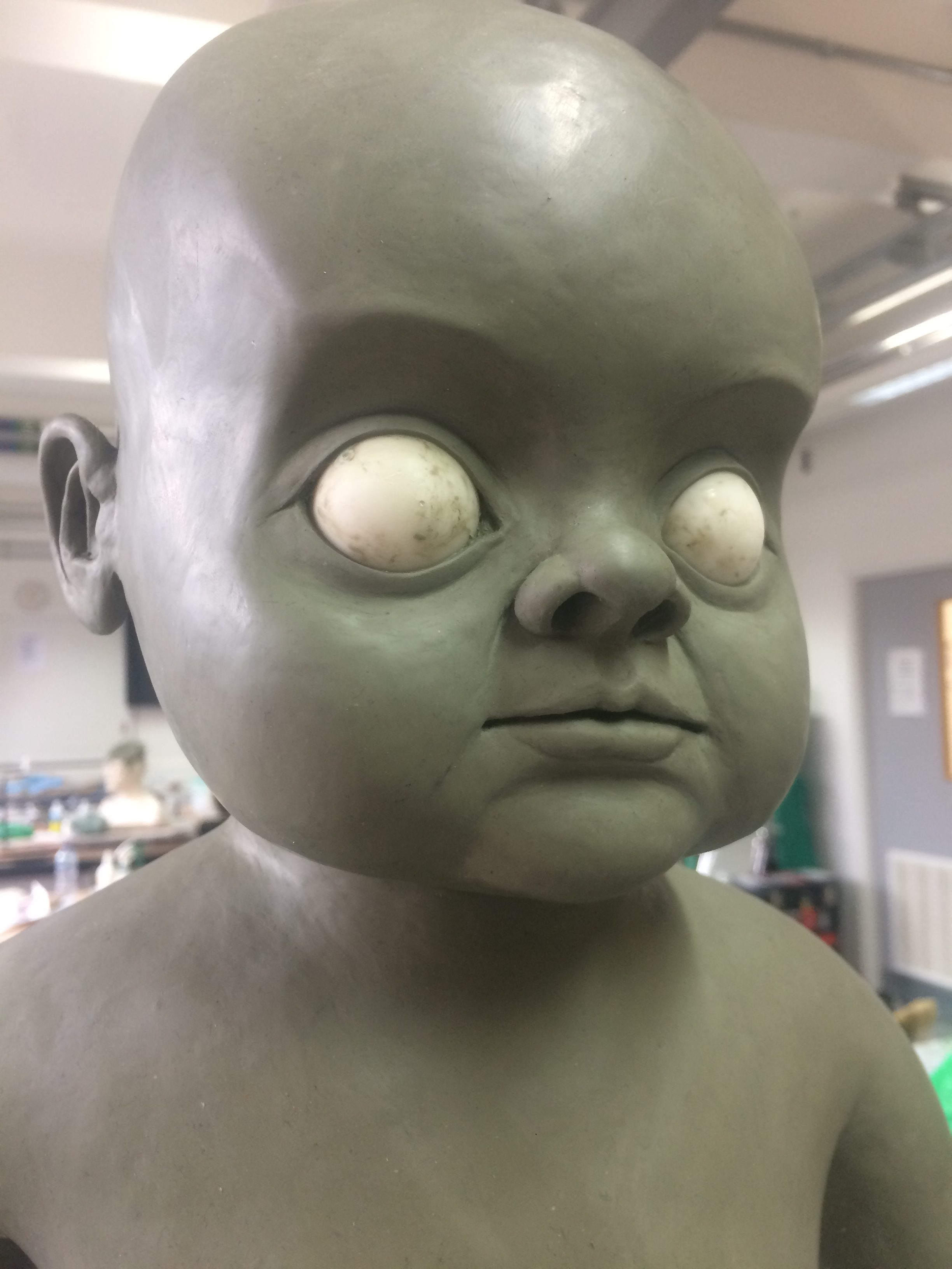 Baby face features sculpture detail