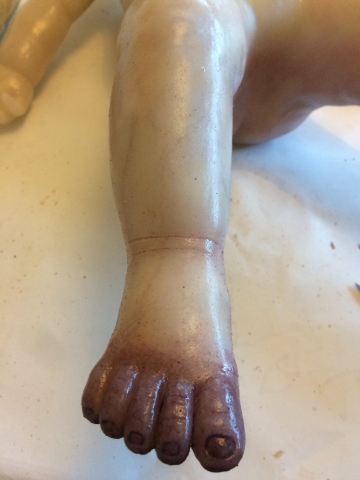Painting silicone cast foot oil paint